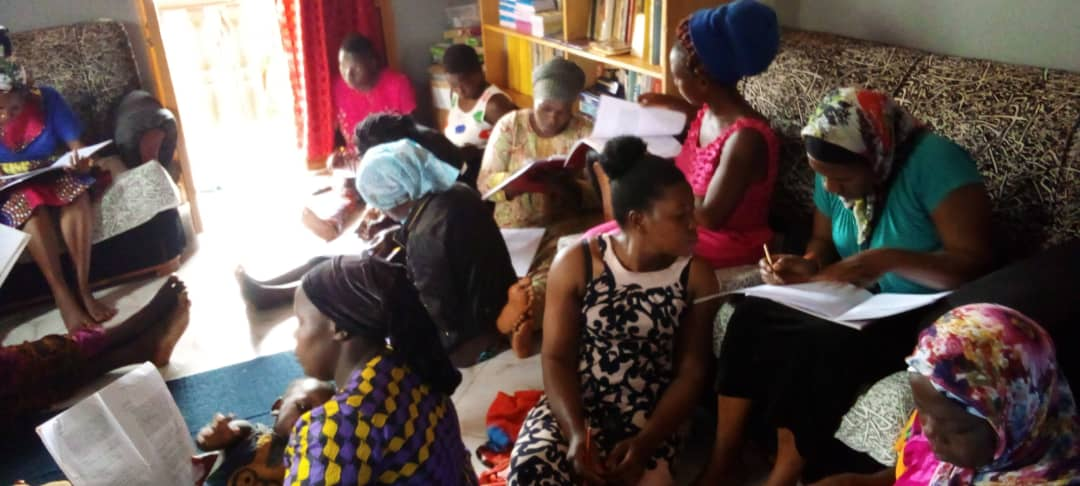 A group of young mothers studying Book 1 in Wanyange Village